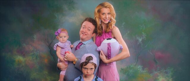 Lisa, Dennis, their son Bob, their adopted daughter Madison (now Paige), and their newborn soccer ball, in a family portrait from Greener Grass.