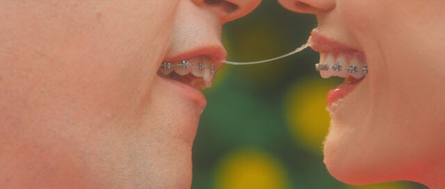 Dennis and Jill share an extra-marital kiss in Greener Grass.