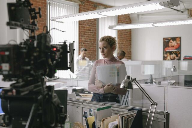 Julia Garner prepares for a take on the set of The Assistant. — Photographer… Ty Johnson