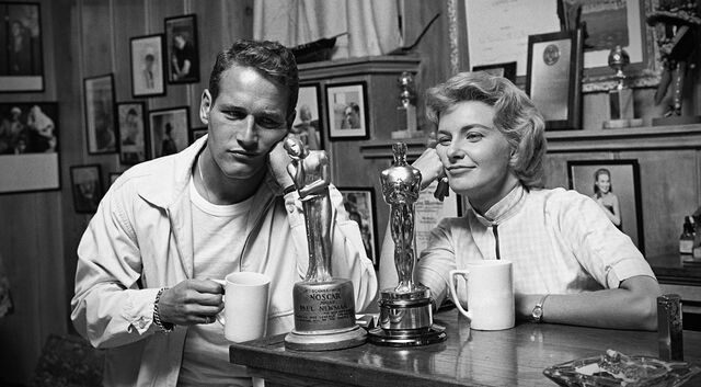 Hollywood legends: Paul Newman with his “Noscar” and Joanne Woodward with her Oscar for The Three Faces of Eve (1957). — Photographer… Sid Avery