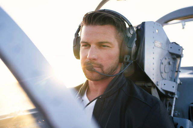 Aerial coordinator Kevin LaRosa II strapped into the cockpit.