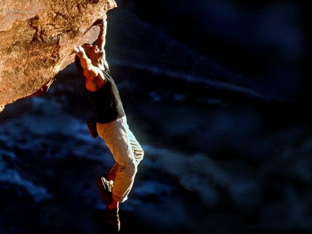This free climb ain’t free: Tom Cruise in the opening stunt of Mission: Impossible II (2000).