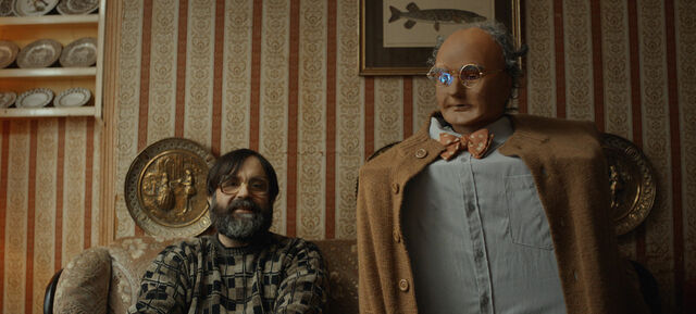 Brian and Charles get seated for movie night.