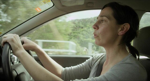 Jackie van Beek as Jackie in What We Do in the Shadows (2014).