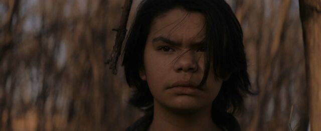 A younger Makwa, played by Phoenix Wilson (M'Chigeeng First Nation).